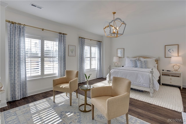 bedroom with crown molding, multiple windows, visible vents, and wood finished floors