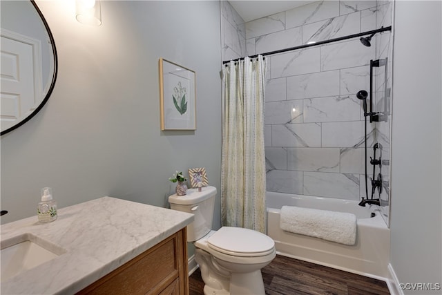 full bathroom featuring toilet, shower / tub combo, wood finished floors, and vanity