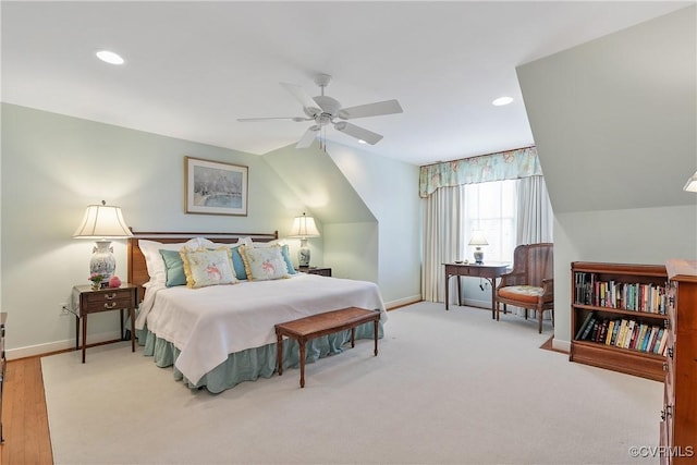 carpeted bedroom featuring vaulted ceiling, recessed lighting, and baseboards