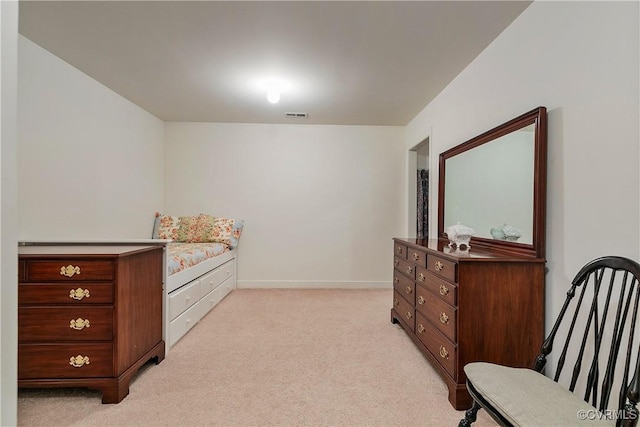 bedroom with light colored carpet, visible vents, and baseboards