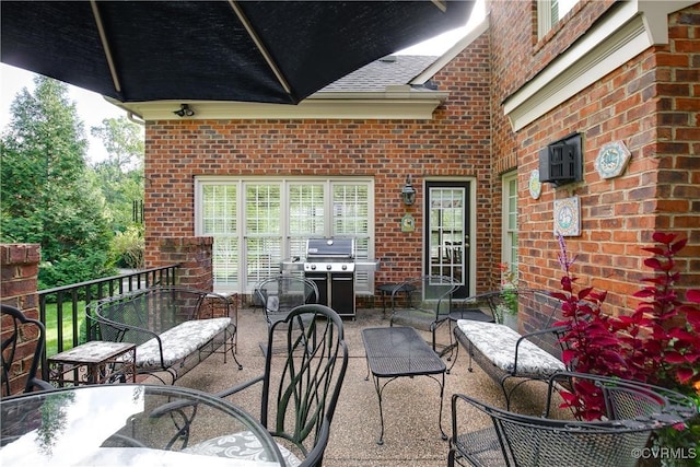 view of patio / terrace with outdoor dining area, a grill, and an outdoor living space