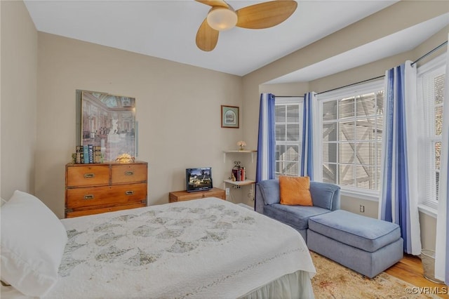 bedroom featuring ceiling fan and wood finished floors