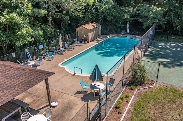 pool featuring a patio area and fence