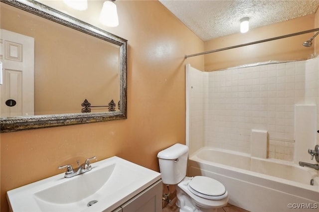 full bathroom featuring a textured ceiling, tub / shower combination, vanity, and toilet