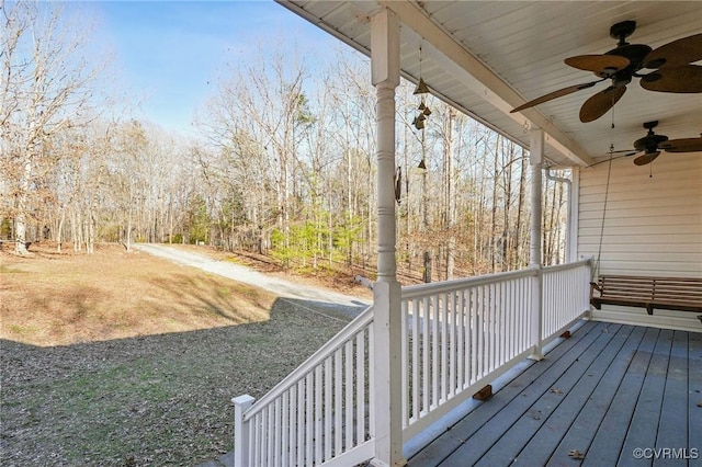 wooden deck featuring a ceiling fan