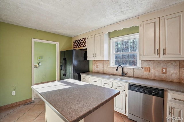 kitchen with a sink, black fridge with ice dispenser, dishwasher, and light tile patterned floors