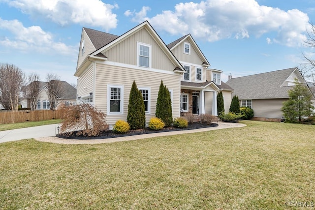 view of front of home featuring a front lawn and board and batten siding