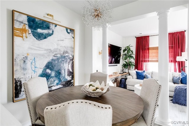 dining room featuring decorative columns