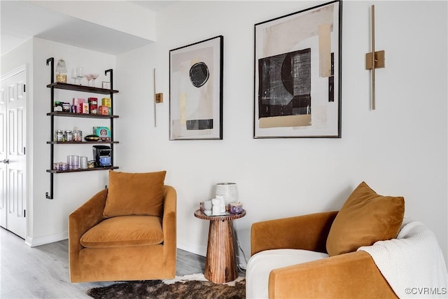 sitting room featuring wood finished floors and baseboards