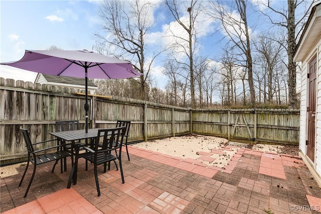 view of patio featuring outdoor dining space and a fenced backyard