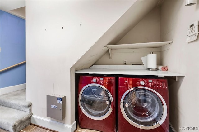 laundry area with baseboards, laundry area, and washer and dryer