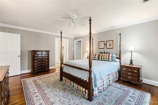 bedroom featuring a ceiling fan, baseboards, wood finished floors, and ornamental molding