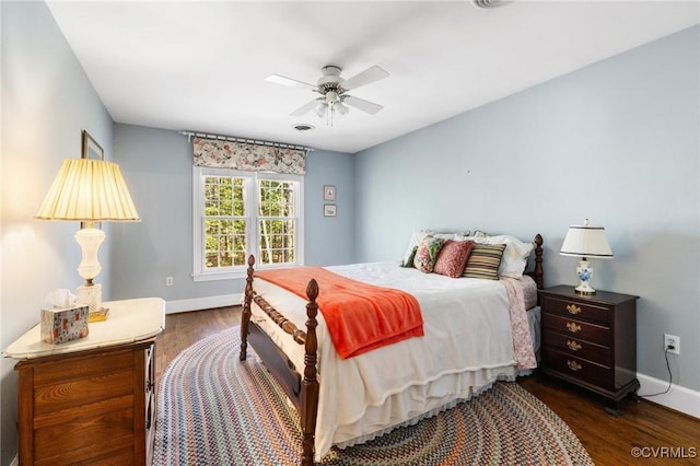 bedroom with a ceiling fan, dark wood-style flooring, visible vents, and baseboards