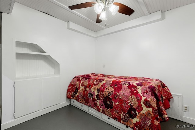 bedroom with finished concrete flooring and ceiling fan