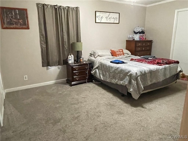 carpeted bedroom with baseboards and ornamental molding