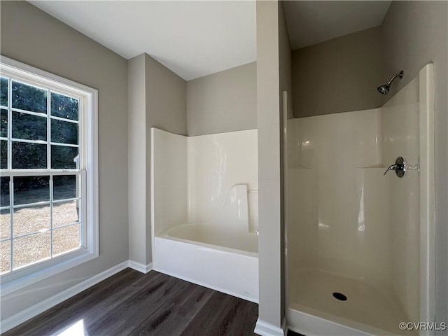 full bath with baseboards and wood finished floors