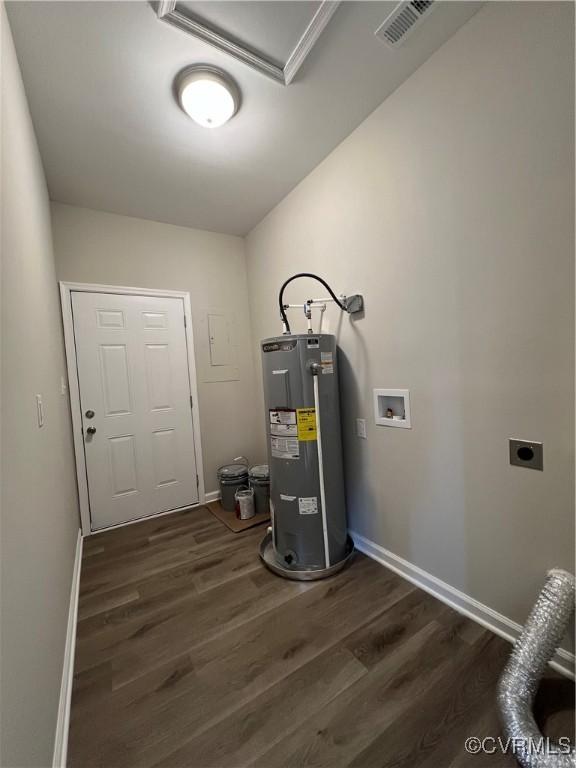 utility room featuring visible vents and electric water heater