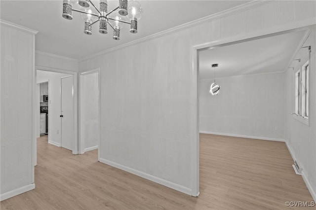 interior space featuring baseboards, ornamental molding, light wood-type flooring, and a notable chandelier