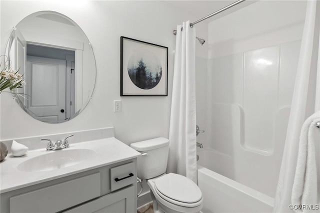 bathroom featuring shower / tub combo with curtain, vanity, and toilet