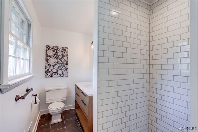 full bathroom featuring tile patterned flooring, toilet, visible vents, vanity, and baseboards