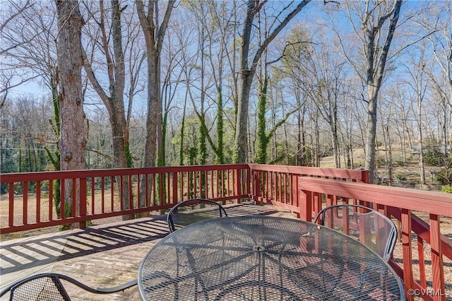 deck with outdoor dining area