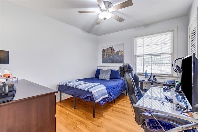 bedroom with light wood-style floors and ceiling fan