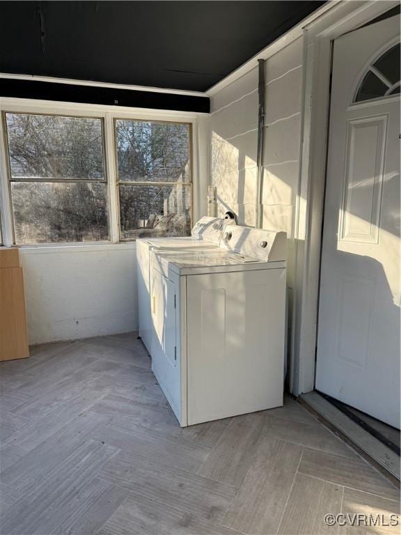 clothes washing area featuring washing machine and clothes dryer