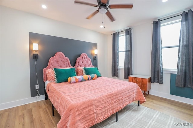 bedroom with light wood-style floors, baseboards, a ceiling fan, and recessed lighting