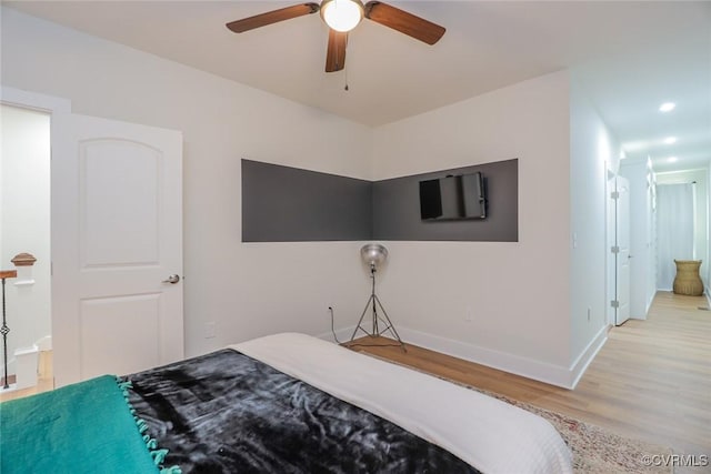 bedroom with light wood finished floors, ceiling fan, baseboards, and recessed lighting