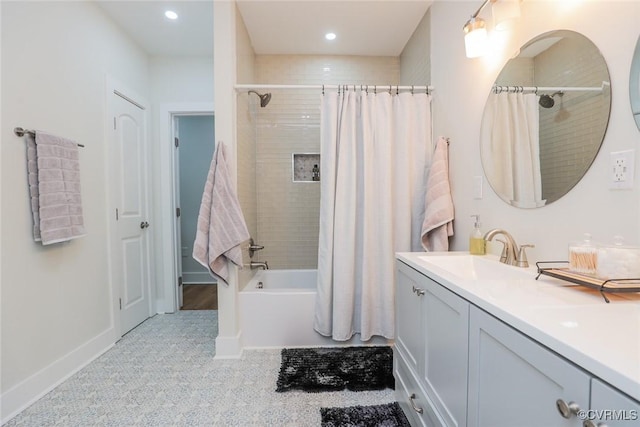 bathroom featuring shower / tub combo, recessed lighting, and vanity