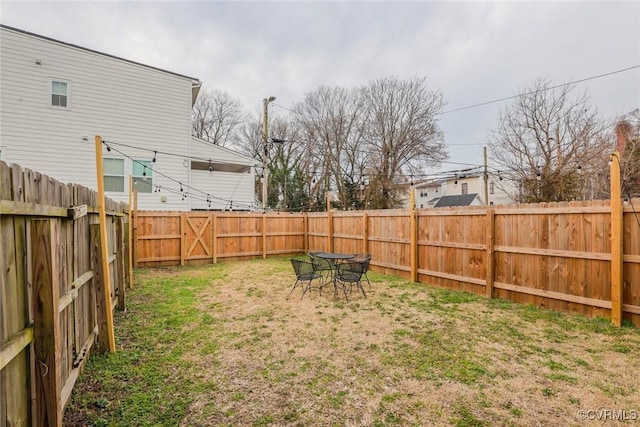 view of yard with a fenced backyard