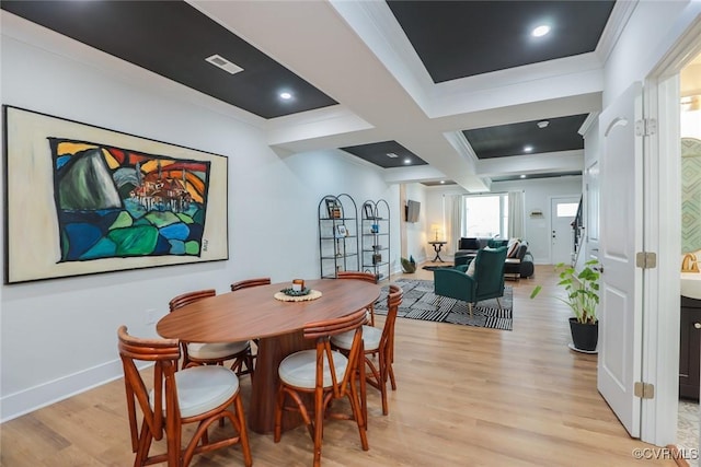 dining area featuring beam ceiling, visible vents, light wood-type flooring, coffered ceiling, and baseboards