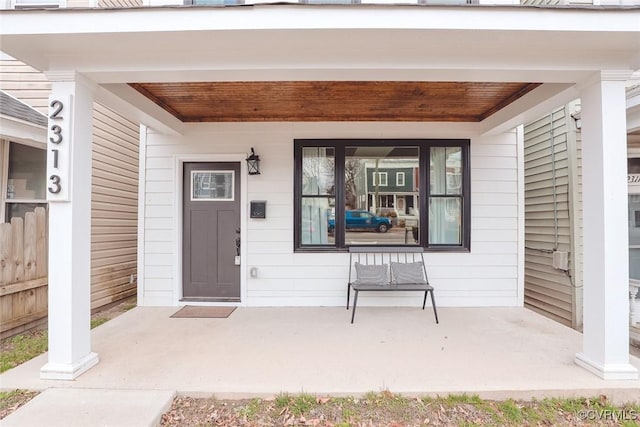 property entrance featuring covered porch