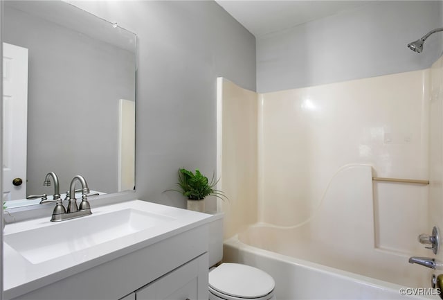 full bath featuring shower / bath combination, vanity, and toilet