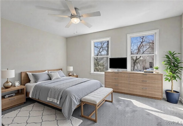 bedroom featuring ceiling fan and light colored carpet