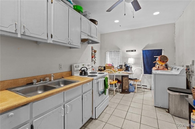 kitchen with white electric range, under cabinet range hood, light tile patterned floors, a ceiling fan, and a sink