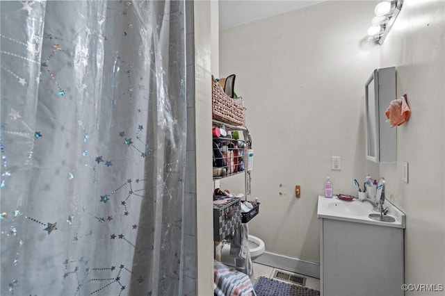 bathroom with tile patterned floors, visible vents, curtained shower, baseboards, and vanity