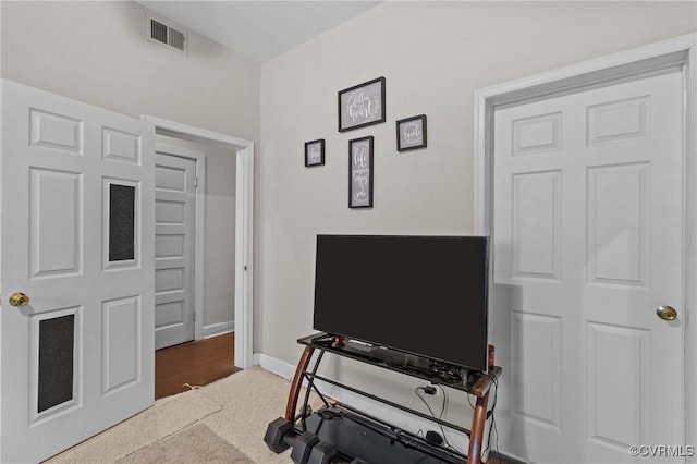 interior space featuring baseboards and visible vents