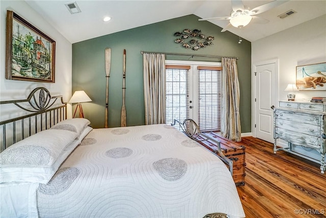 bedroom featuring lofted ceiling, visible vents, and french doors