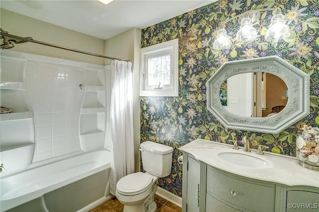 bathroom featuring tile patterned flooring, toilet, vanity, baseboards, and wallpapered walls