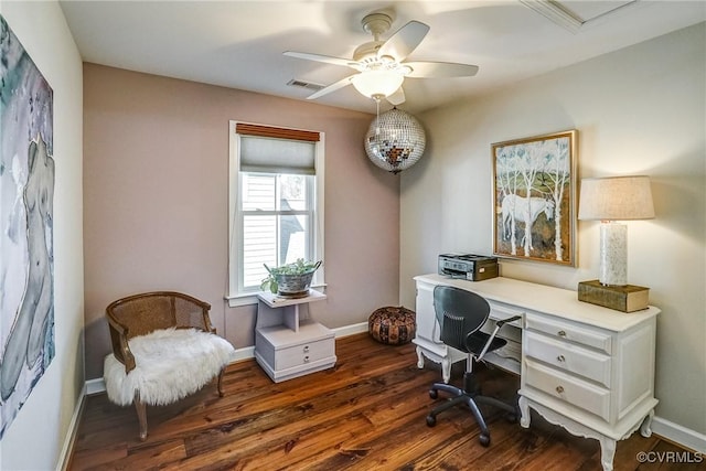 office space featuring a ceiling fan, dark wood-style flooring, visible vents, and baseboards