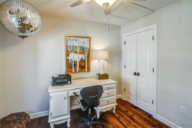 office featuring a ceiling fan, dark wood finished floors, and baseboards