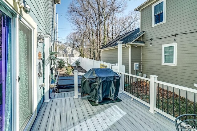 wooden deck featuring fence and grilling area