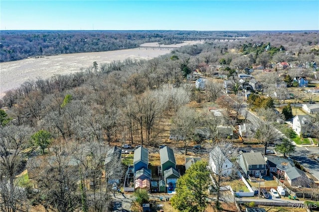 birds eye view of property with a residential view and a view of trees