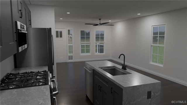 kitchen featuring stainless steel appliances, recessed lighting, a sink, and an island with sink