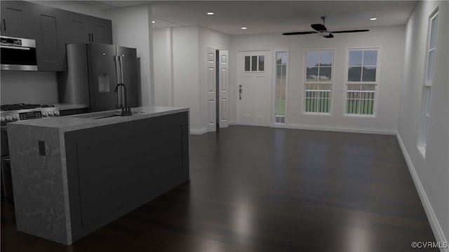 kitchen featuring recessed lighting, a ceiling fan, fridge with ice dispenser, a sink, and baseboards