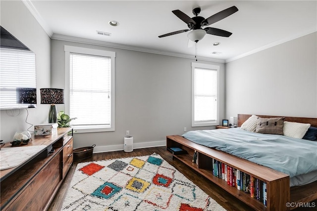 bedroom featuring crown molding, visible vents, dark wood-type flooring, ceiling fan, and baseboards