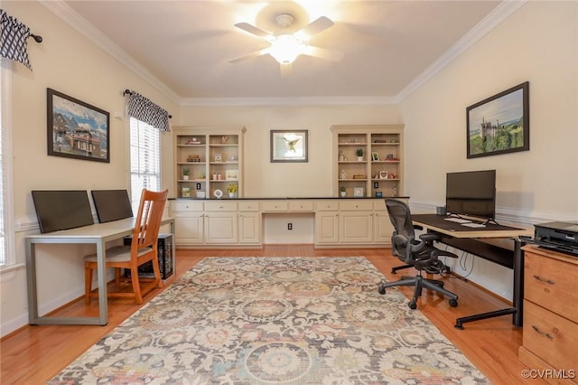 home office with light wood finished floors, baseboards, ornamental molding, and a ceiling fan