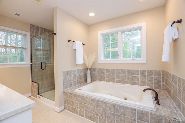 bathroom with visible vents, a stall shower, vanity, a whirlpool tub, and tile patterned floors