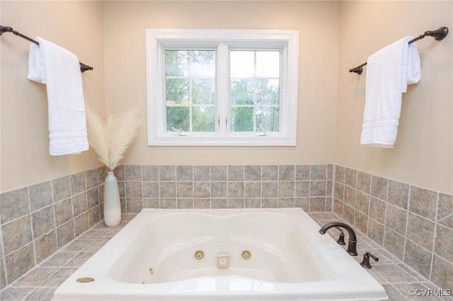 full bathroom with a jetted tub